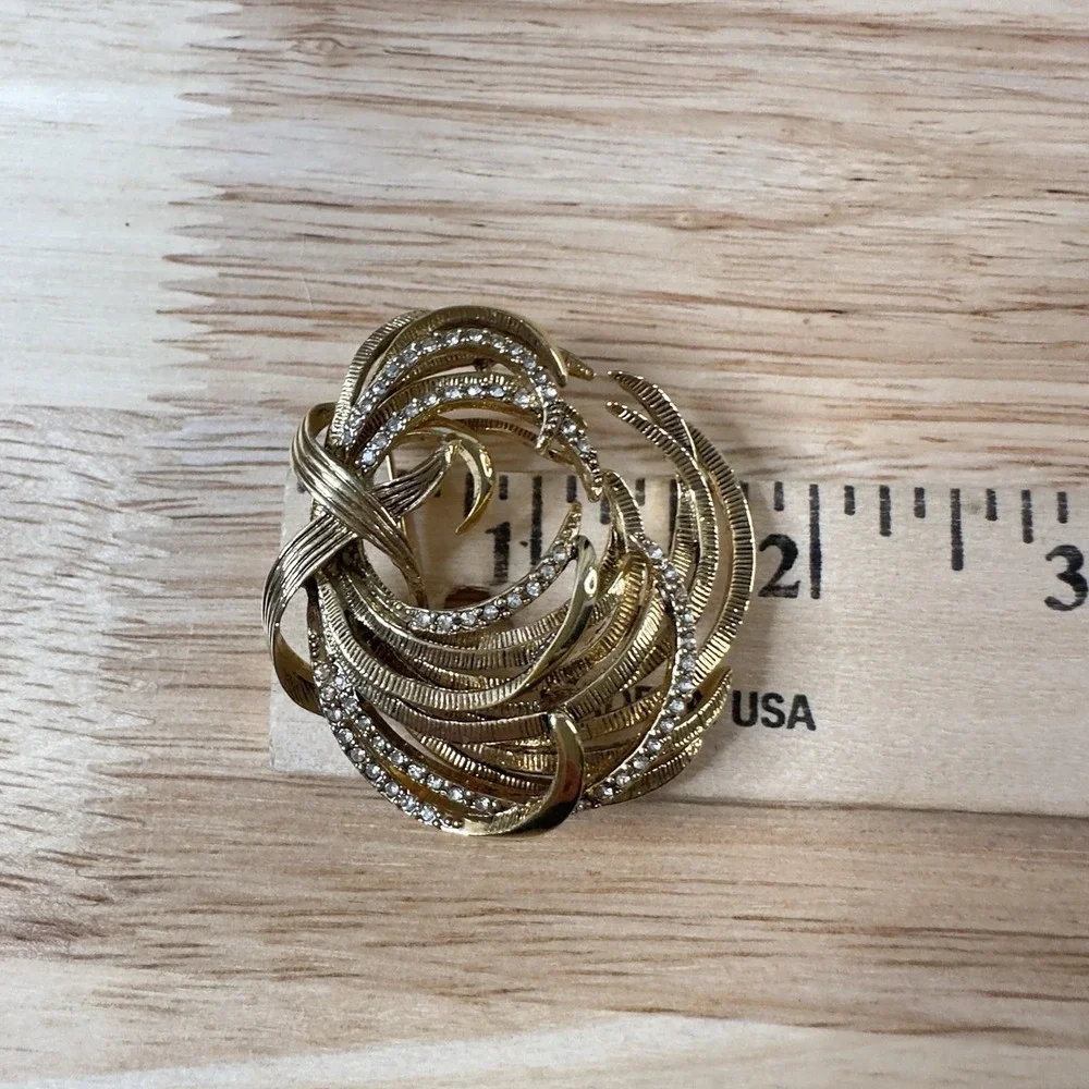 Vintage Monet Gold Tone Etched Swirl Rhinestone Brooch Signed BEAUTY